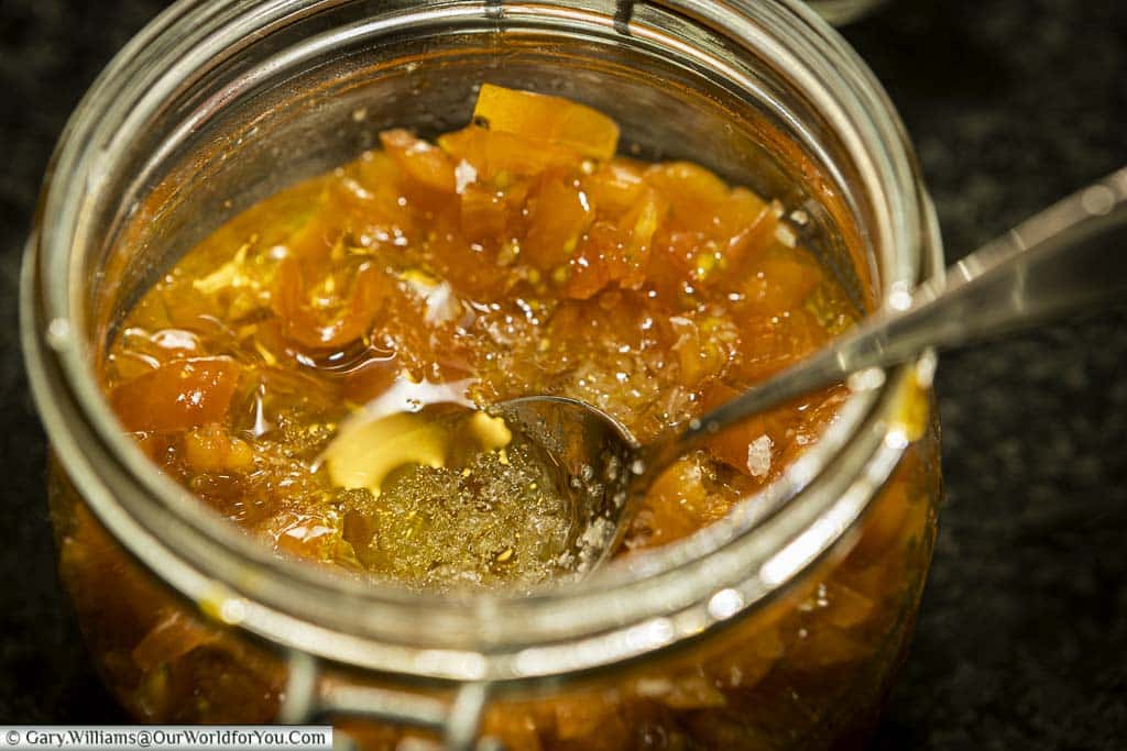 The chopped tomatoes, olive oil and sea salt all in a clip top glass jar.