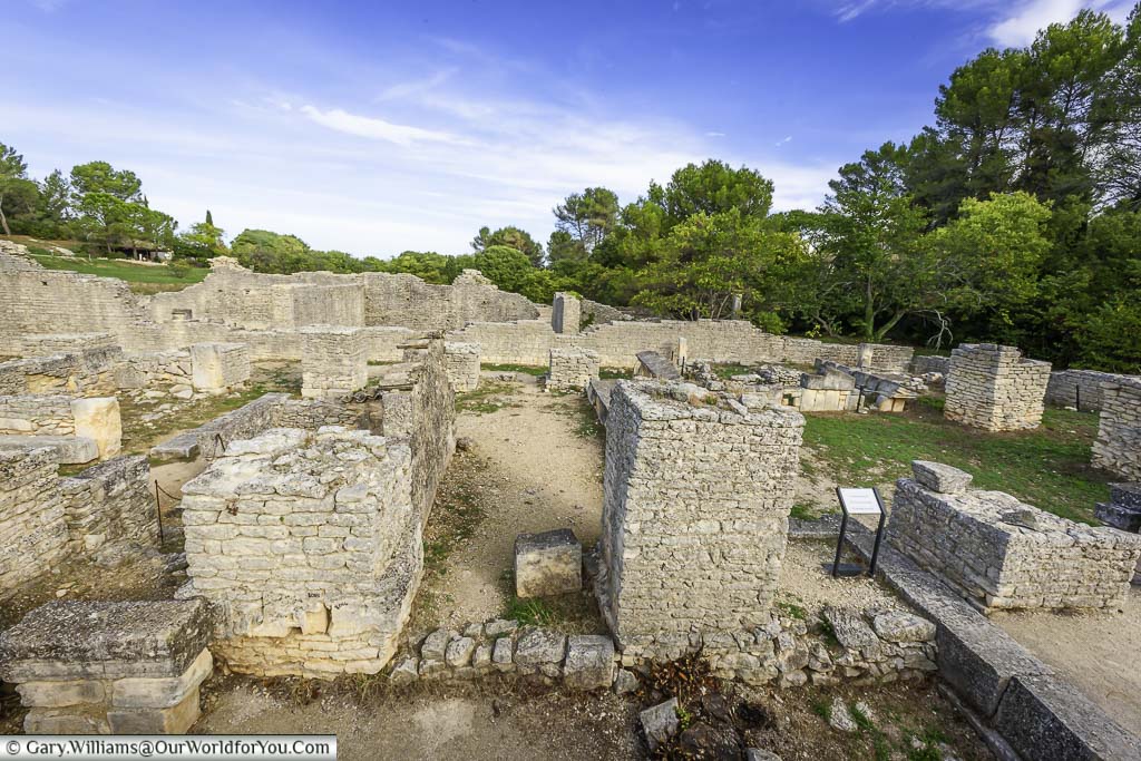 The low brick walls of the remains of the roman city in the archaeological site of glanum, just outside Saint-Rémy-de-Provence, in the south of france