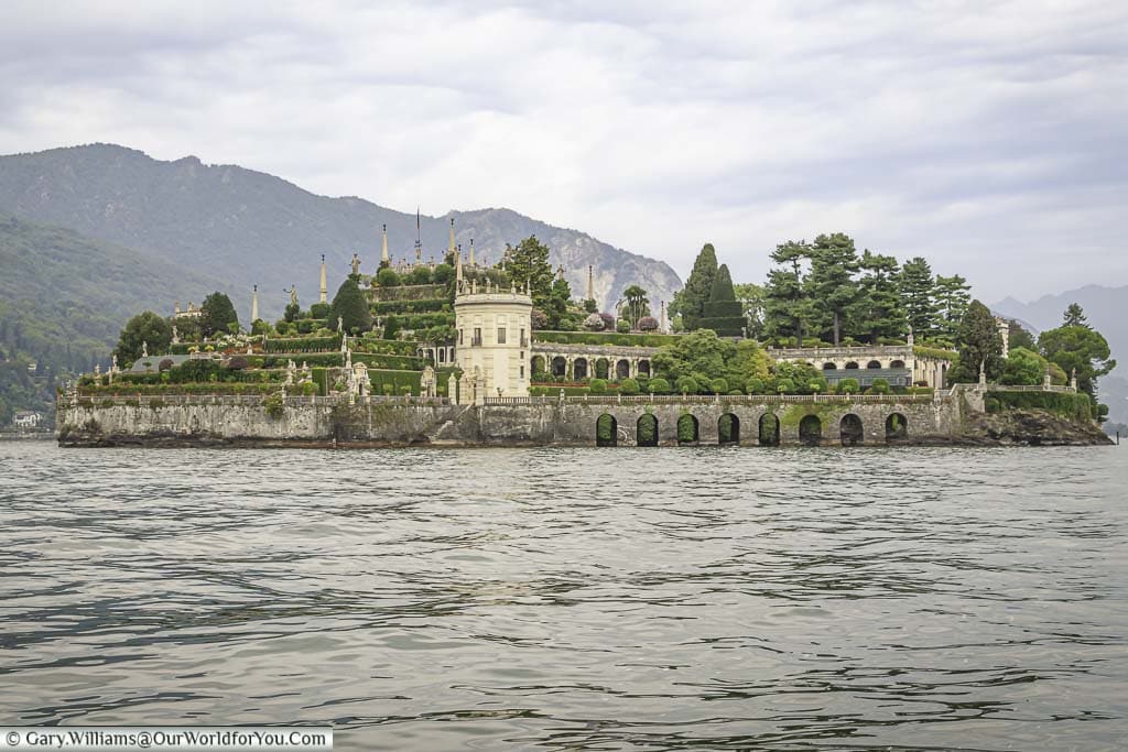 The small island of Isola Bella as seen from the ferry. This view is over the ornate tiered Italian gardens that are a feature of the island.