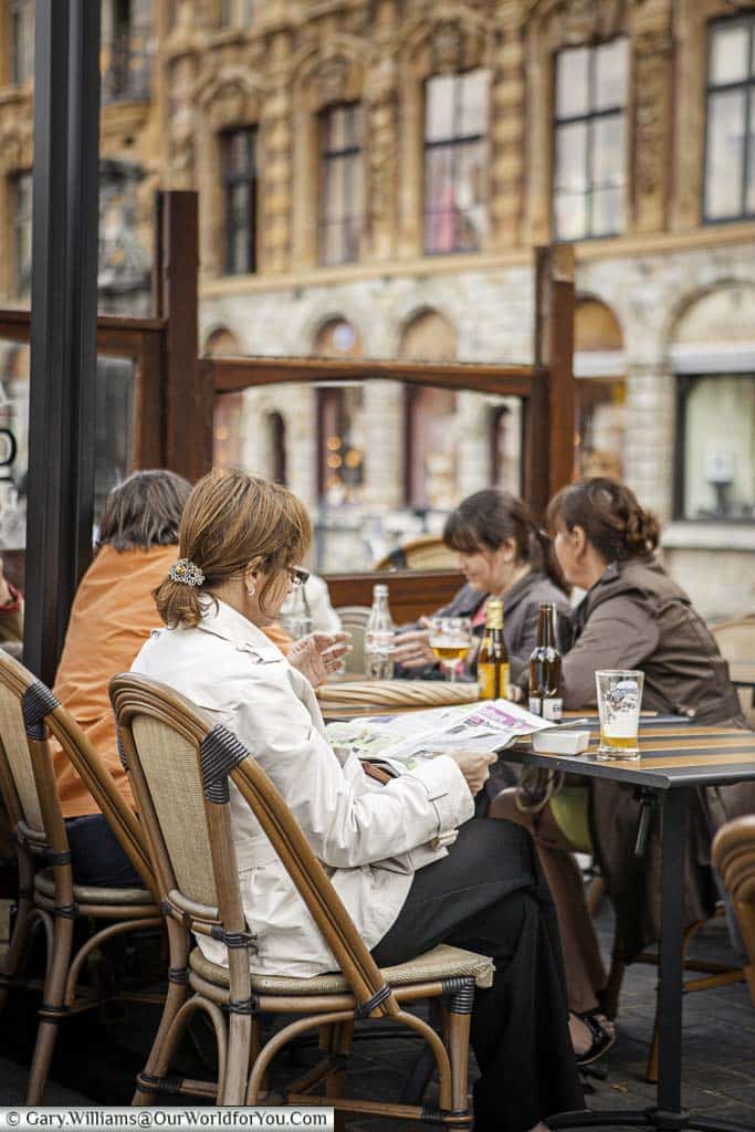 A candid shot of women enjoying beer at outside a café in Lille.