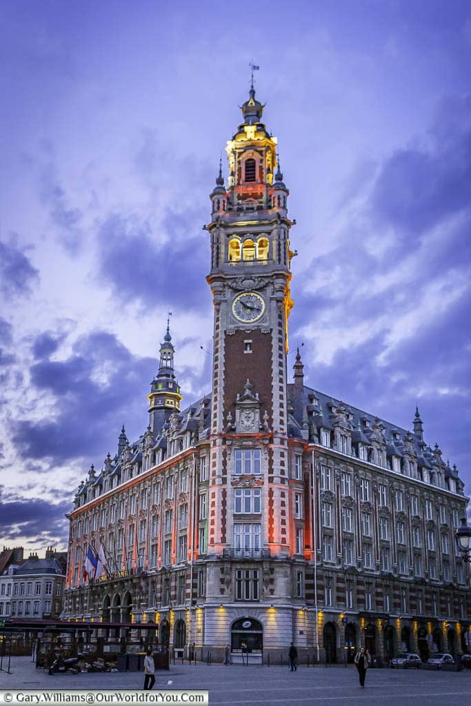 The Belfry of the Chamber of Commerce in Lille at dusk.